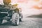 Quadricycle or quad bike on the mountains background on a cloudy day