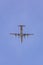 Quadro turboprop airplane flying in blue sky