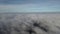 Quadrocopter flies over the clouds.