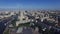 Quadrocopter fly over Moscow city in summer cloudless day. Cityscape. Building Radisson Royal Hotel.