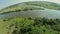 Quadrocopter, flying over the autumn forest. Autumn cloudy day.