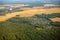 Quadrocopter flying over farmland