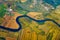 Quadrocopter flying over farmland