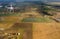 Quadrocopter flying over farmland