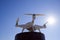 Quadrocopter Phantom 4 against the blue sky in the sun. Backlight. Dron is an innovative flying robot.