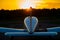 Quadruple aircraft parked at a private airfield. Rear view of a plane with a propeller on a sunset background.