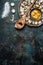 Quail eggs with cooking spoon on rustic background, top view.