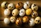 quail eggs grouped and lined out on rustic wooden table