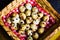 Quail eggs in a heart shaped bowl and hands. Cenital view. Top view.