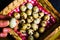 Quail eggs in a heart shaped bowl and hands. Cenital view. Top view.