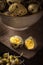 Quail eggs with mung bean sprouts in a bowl on dark wooden board