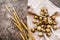 Quail eggs on a table linen with ears of wheat on textured background