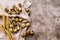 Quail eggs on a table linen with ears of wheat on textured background