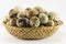 Quail eggs in a wicker oval shape