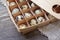 Quail eggs. The wooden packing box