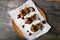 Quail on a wooden background. On a wooden background. Little turkey. Close-up. Three quails. Small bird. Chicken replacement