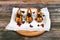 Quail on a wooden background. On a wooden background. Little turkey. Close-up. Three quails. Small bird. Chicken replacement