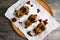 Quail on a wooden background. On a wooden background. Little turkey. Close-up. Three quails. Small bird. Chicken replacement