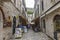 The quaint alley between old buildings with shops and cafe at Dubrovnik Old Town in Dubrovnik, Croatia.