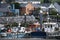 A quaint bayside village in front of boats in Dingle, Ireland.