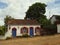 A quaint colonial home decorated for Christmas in a quiet street