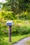 Quaint country mailbox stands by a gravel road