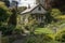 quaint garden cottage, with view of the gardens and rolling hills in the distance