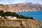 Quaint homes on cliffside hills overlooking bay of water