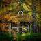Quaint house cloaked in autumn foliage, with a whimsical round window peeking through the leaves