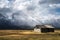 quaint Moulton barn wintry autumn weather on snow capped Grand Teton national Park in Wyoming