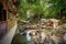 Quaint park near a tranquil creek, with multiple rustic wooden cabins in Darband, Tehran, Iran