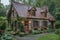 A quaint stone cottage in a lush garden