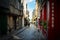 Quaint street in the Normandy town of Honfleur France with Saint Catherine`s church in the distance on a sunny day in early autumn