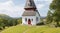 Quaint village chapel perched on a hill.