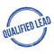 QUALIFIED LEAD text written on blue grungy round stamp