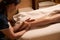 Qualified masseuse giving Thai feet massage to spa client