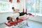 Qualified physiotherapist carrying out client rehabilitation with gym equipment