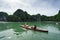 Quang Ninh, Vietnam - Aug 12, 2017: Halong bay in Vietnam, UNESCO World Heritage Site, with tourist paddling kayak