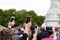 Quantity of mobile phone cameras raised to film and photograph the changing of the guard