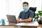 Quarantine, asian man wearing face protective medical mask for protection from virus disease with laptop computer working at home