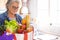 Quarantine for coronavirus Covid-19 pandemic. Casual senior woman with protective gloves receives grocery delivery at home with