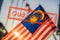 Quarantine due to coronavirus epidemic covid19 Malaysia flag also known as Jalur Gemilang wave with the blue sky. People