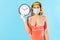 Quarantine time, stay at home! Woman in swimsuit, wearing hygienic face mask and surgical gloves