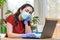 Quarantine.A young woman in a medical mask and gloves leaned lazily on her arm, looking bored. Home environment.Close up.The