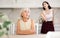 Quarrel of an elderly mother and adult daughter at home. Adult daughter is unhappy with mother