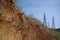 Quarry and high-voltage towers.Stones in the foreground. Quarry and high-voltage towers.