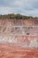 quarry mine of porphyry rock. earthmover bulldozer driving around