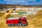 Quarry, mining and construction, excavators and trucks, view from above