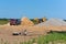 Quarry sand mining, truck and excavator next to a pile of sand