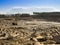 Quarrying in a huge quarry. Work on the excavator